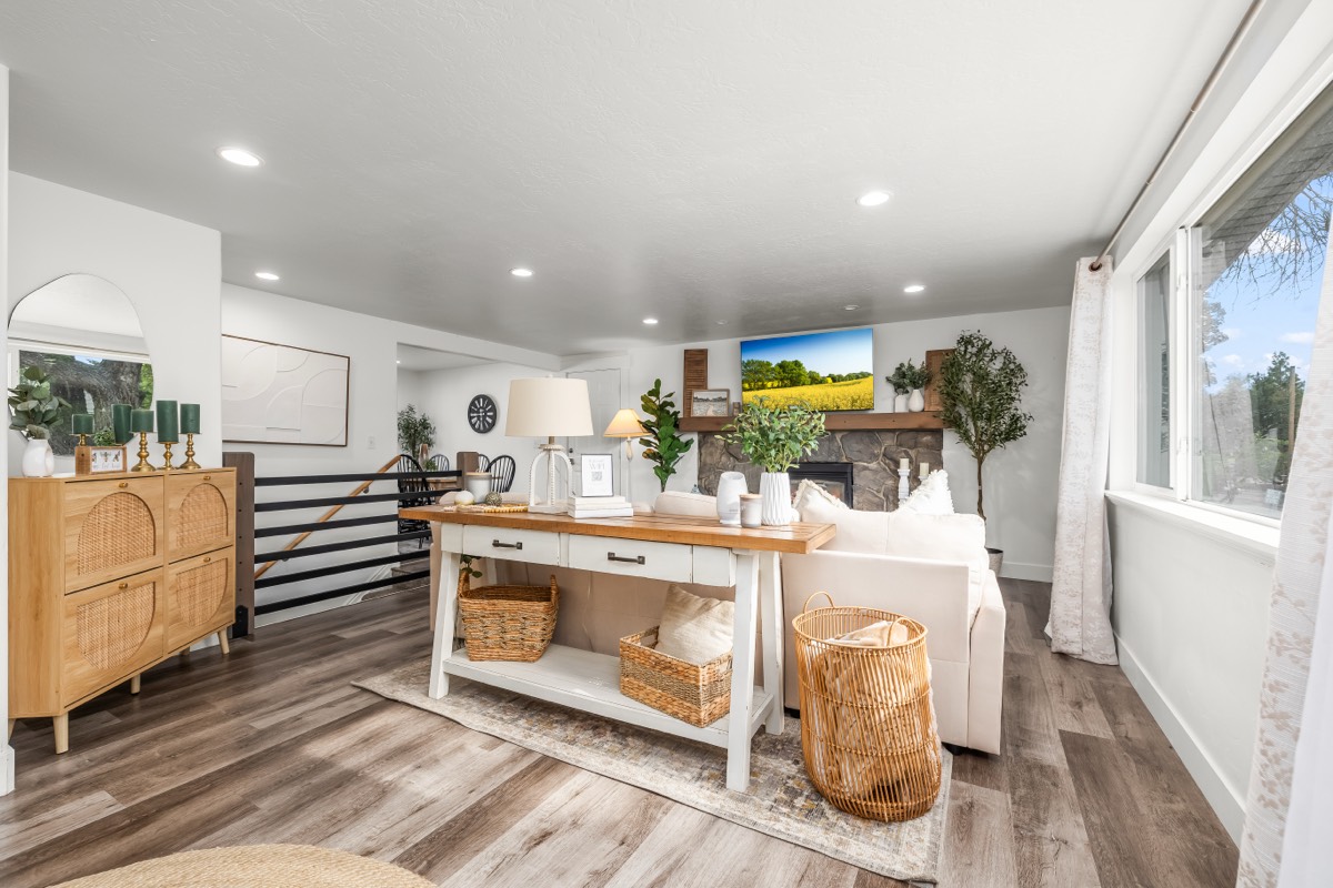 Bright farmhouse-style living room with natural wood and woven textures